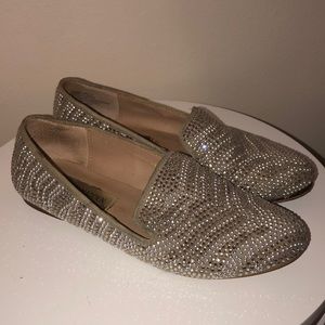 Silver and gold loafers.
